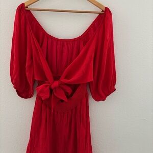 Elegant red mini dress with puff sleeves and tie back size small.